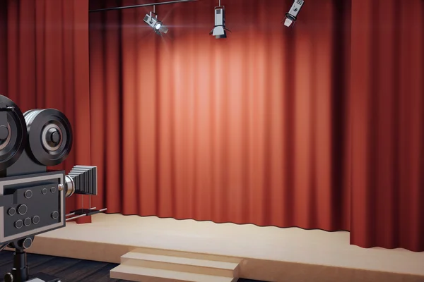 Пустая сцена с красными сценами, прожекторами и винтажной кинокамерой — стоковое фото