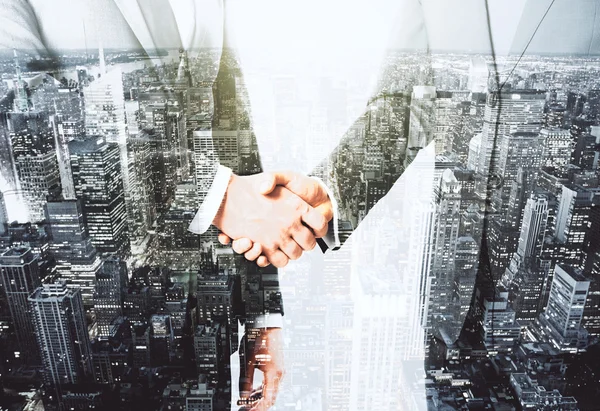 Double explosure with businessmen shaking hands and night city v — Stock Photo, Image