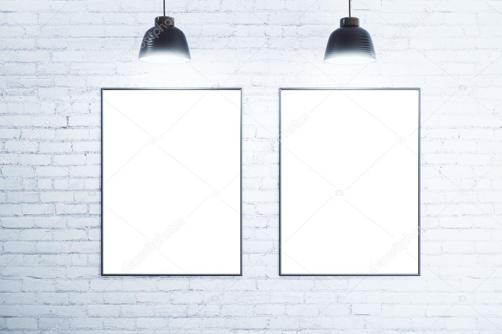White brick wall with blank white posters, mock up