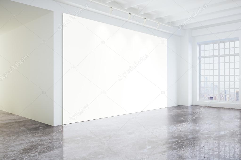 Blank poster in light modern loft gallery with big windows and c