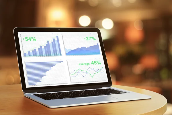 Üzleti diagram laptop képernyő kerek fa asztal — Stock Fotó