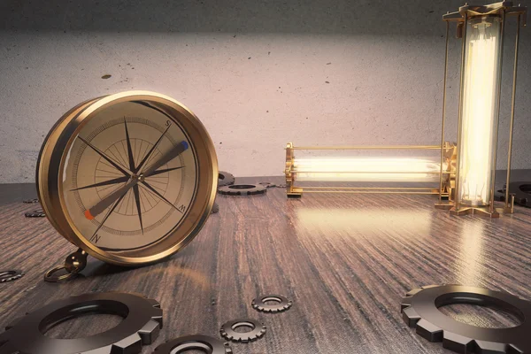 Винтажный компас на деревянном столе с лампами и винтиками — стоковое фото
