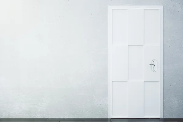 Concrete wall and white door with copyspace — Stock Photo, Image