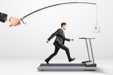 Reach a goal concept with businessman running on a treadmill for clipart