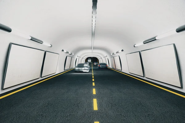 Blank billboards in the tunnel with cars — Stock Photo, Image