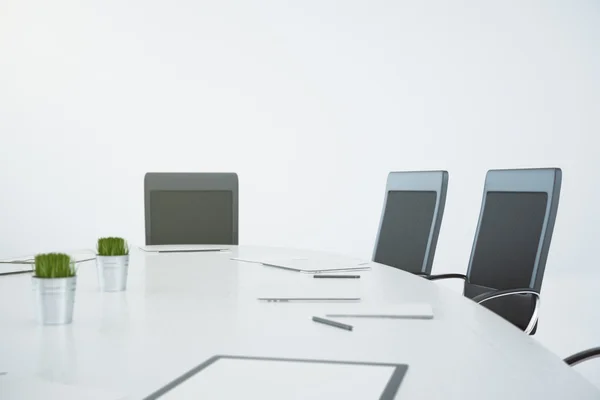 White conference table with chairs and papers — Stock Photo, Image