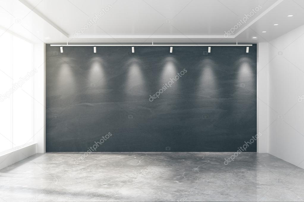 Empty room with big windows, blank blackboard, lamps and concret