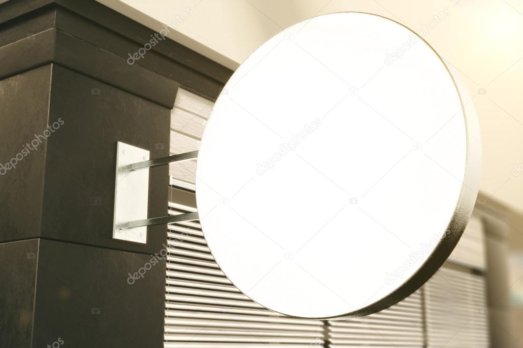 Blank white round signboard on the wall of building outdoor, moc