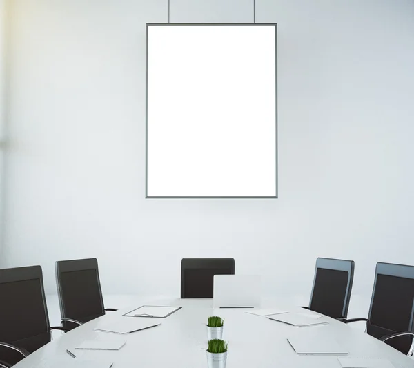Meeting room with table and chairs and blank picture frame, mock — Stock Photo, Image