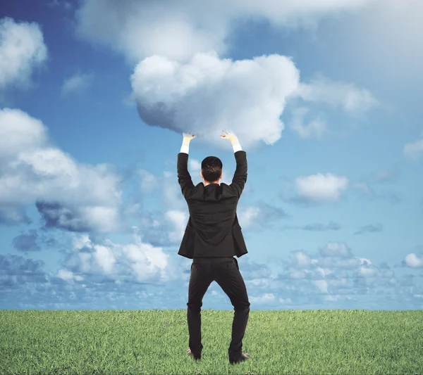 Man pushes a cloud to the sky concept — Stock Photo, Image