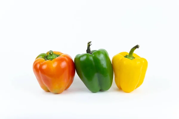 Fresh Vegetables Juicy Red Yellow Green Peppers Green Stem Stands — Stock Photo, Image