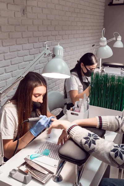 Manicurist Makes Blue Gloved Manicure Client Using Electric Nail File — Stock Photo, Image