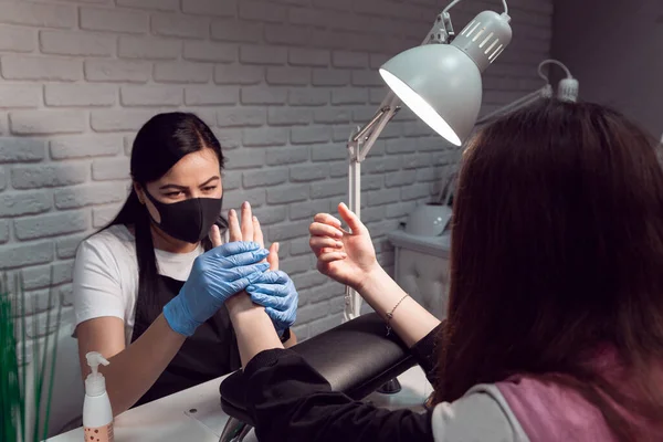 Manicurist Does Hand Massage Applying Hand Cream Female Hands Hardware — Stock Photo, Image