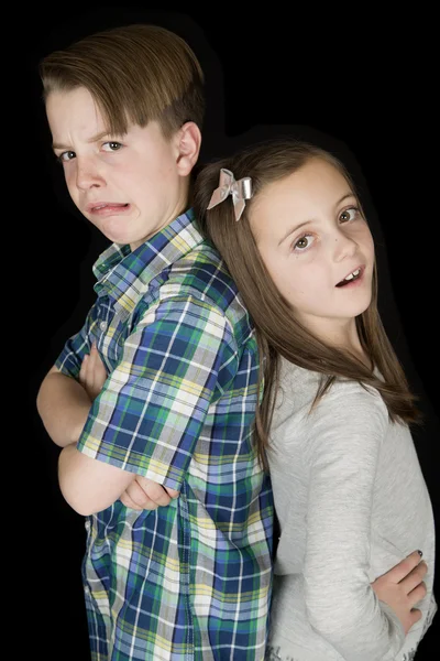 Crazy facial expression portrait of young boy and girl black bac — Stock Photo, Image