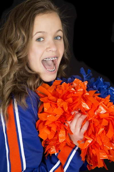 Cute teen cheerleader cheering excited with her mouth open weari — Stock Photo, Image