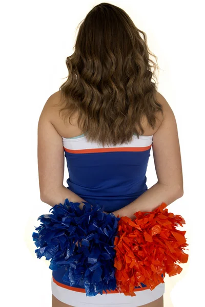 Download Pretty teen cheerleader standing holding orange and white ...