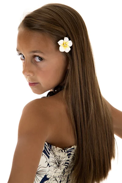 Beautiful tan girl wearing island dress looking over her shoulde — Stock Photo, Image