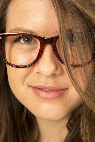 Girl wearing big glasses hair over one eye — Stock Photo, Image