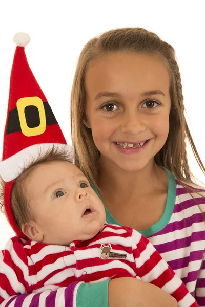 Sœurs en pyjama bébé en chapeau de Père Noël — Photo