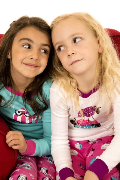 Adorable young girls portrait looking at each other — Stock Photo, Image