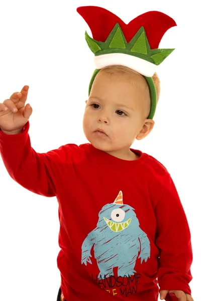 Mladík na sobě pyžamo a vánoční skřítek klobouk Stock Obrázky