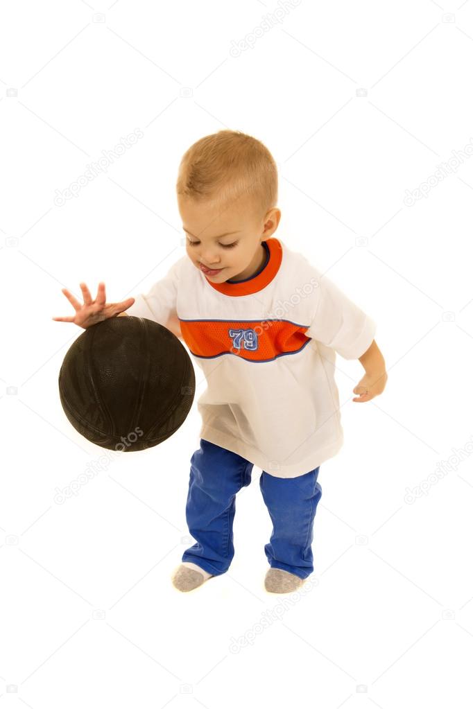 Cute two year old boy bouncing black basketball — Stock Photo ...