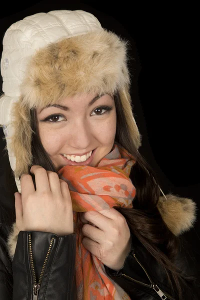 Asian Caucasian teen snuggling her scarf and winter hat — Stock Photo, Image