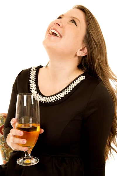 Leuke jonge vrouw met een glas wijn opzoeken lachen — Stockfoto