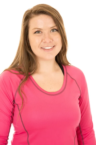 Brunette female model wearing a pink workout shirt — Stock Photo, Image