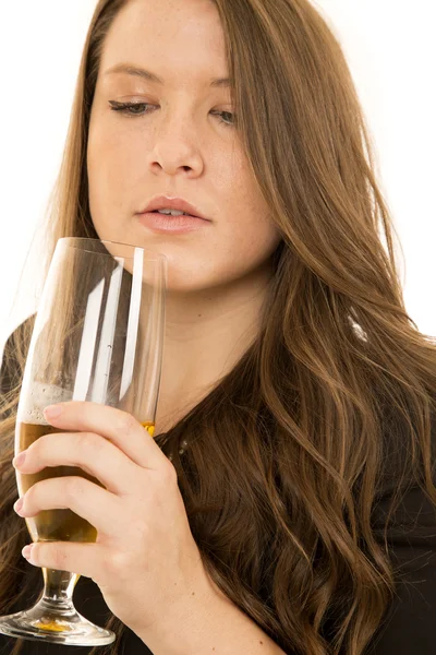 Young female model looking into her wine glass — Stock Photo, Image