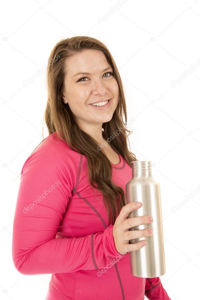 Sideview of a woman holding a stainless steel water bottle
