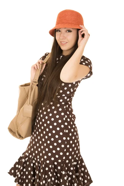 Cute teen girl model wearing a polka dot dress and orange hat — Stock Photo, Image