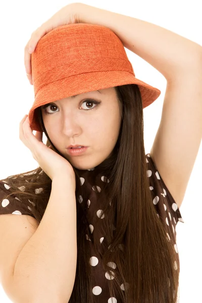 Pretty Asian American teen girl model wearing an orange hat Stock Image