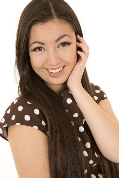 Asian American beauty wearing brown polka dot dress smiling — Stock Photo, Image