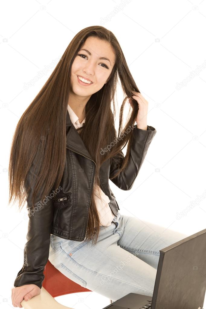 Cute Teen Girl Sitting On The Back Of Her School Desk Chair With