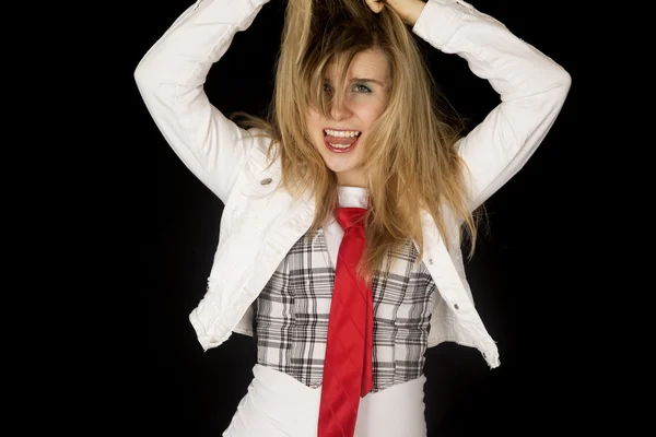 Crazy excited female model with her tongue out pulling hair up — Stock Photo, Image