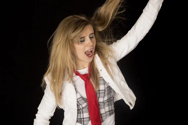 Rocking young female model with her arm and hair up in the air — Stock Photo, Image