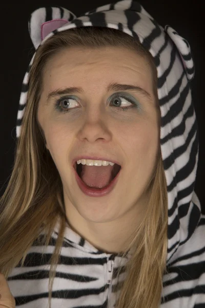 Young woman wearing cat pajamas surprised facial expression — Stock Photo, Image