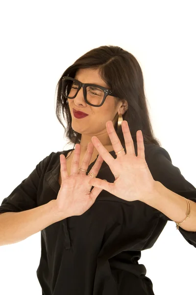 Woman wearing black glasses pushing hands away eyes closed — Stock Photo, Image