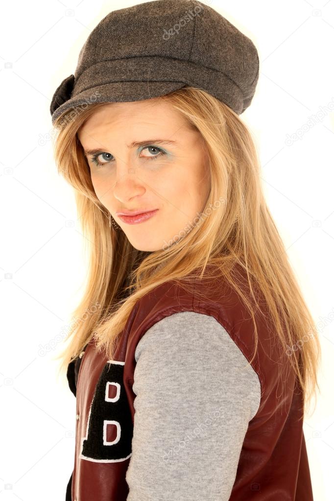 Young woman wearing letterman jacket and a gray hat