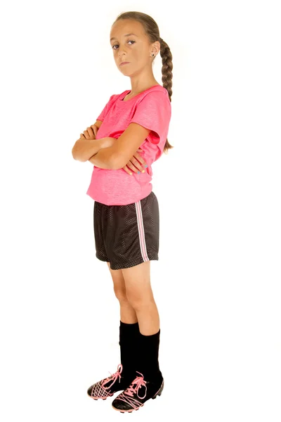 Young girl soccer player standing with her arms folded — Stock Photo, Image