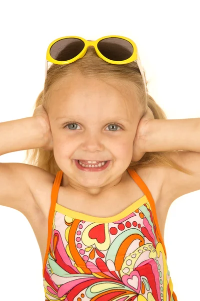 Cute blond girl wearing swimsuit hands over her ears — Stock Photo, Image