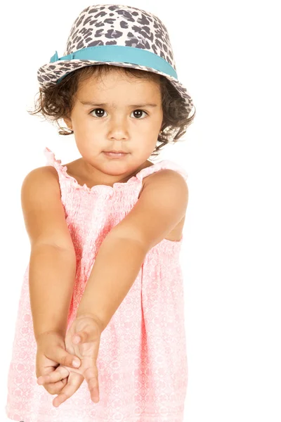 Cute Hispanic toddler girl wearing a leopard print hat — Stock Photo, Image