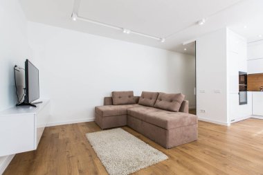 İç mekan fotoğrafçılığı, mutfak stüdyosu olan modern oturma odası, tavan arası tarzı, parlak renkler.