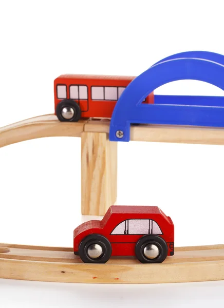 A slot wooden cars race set on a track over white background