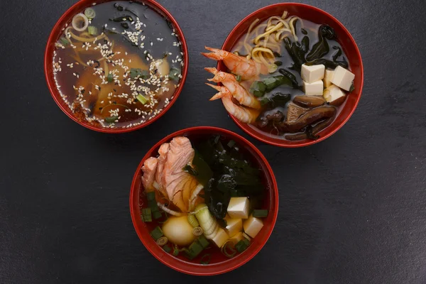 Japanese cuisine. Soup over black background. — Stock Photo, Image