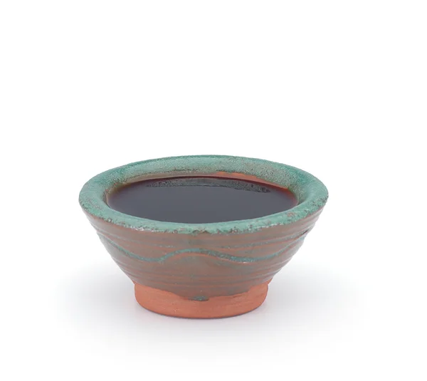 Soy sauce in a clay sauce-boat isolated on white background — Stock Photo, Image