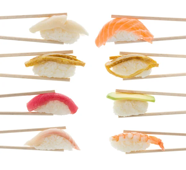 Sushi nigiri in chopsticks isolated on white background — Stock Photo, Image