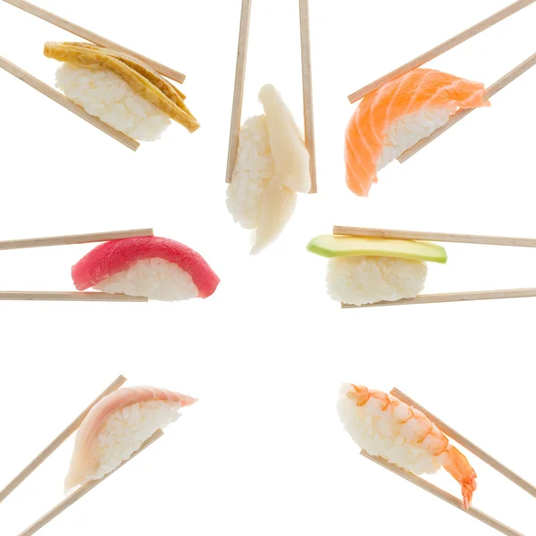 Sushi nigiri in chopsticks isolated on white background — Stock Photo, Image