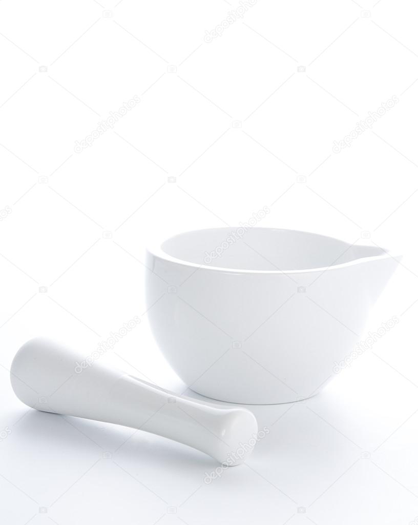 White porcelain mortar and pestle set isolated on white background
